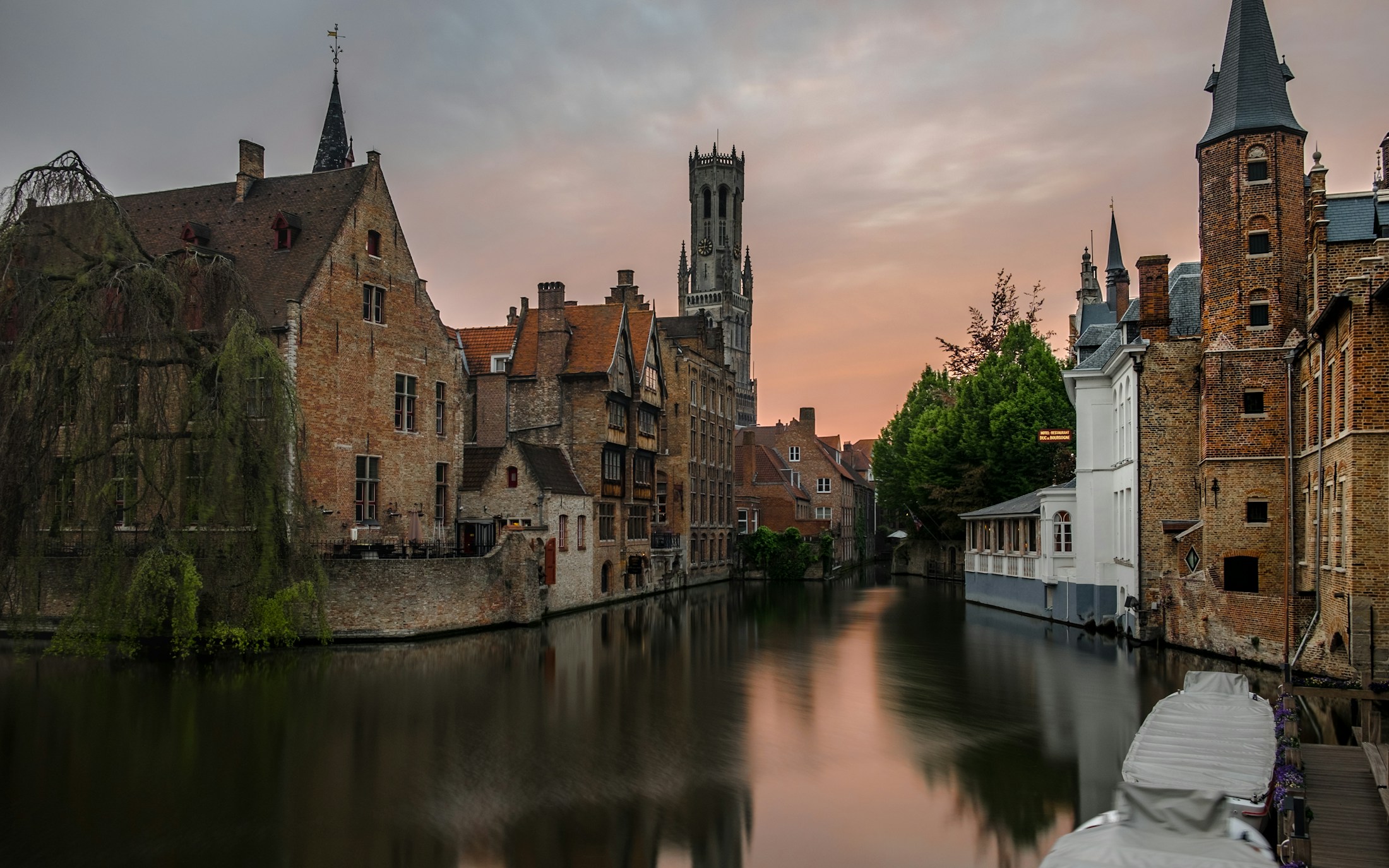 Bruges skyline and canals in warm evening light