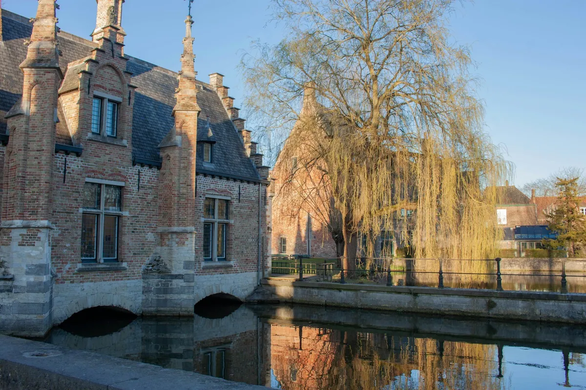 Historic Bruges architecture reflected in a quiet canal
