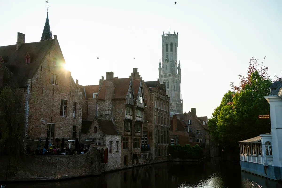 The Belfry rising above the historic buildings of Bruges