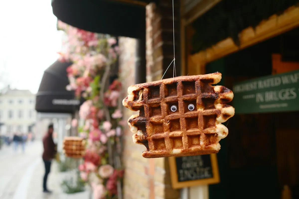 A waffle-shaped shop sign in Bruges