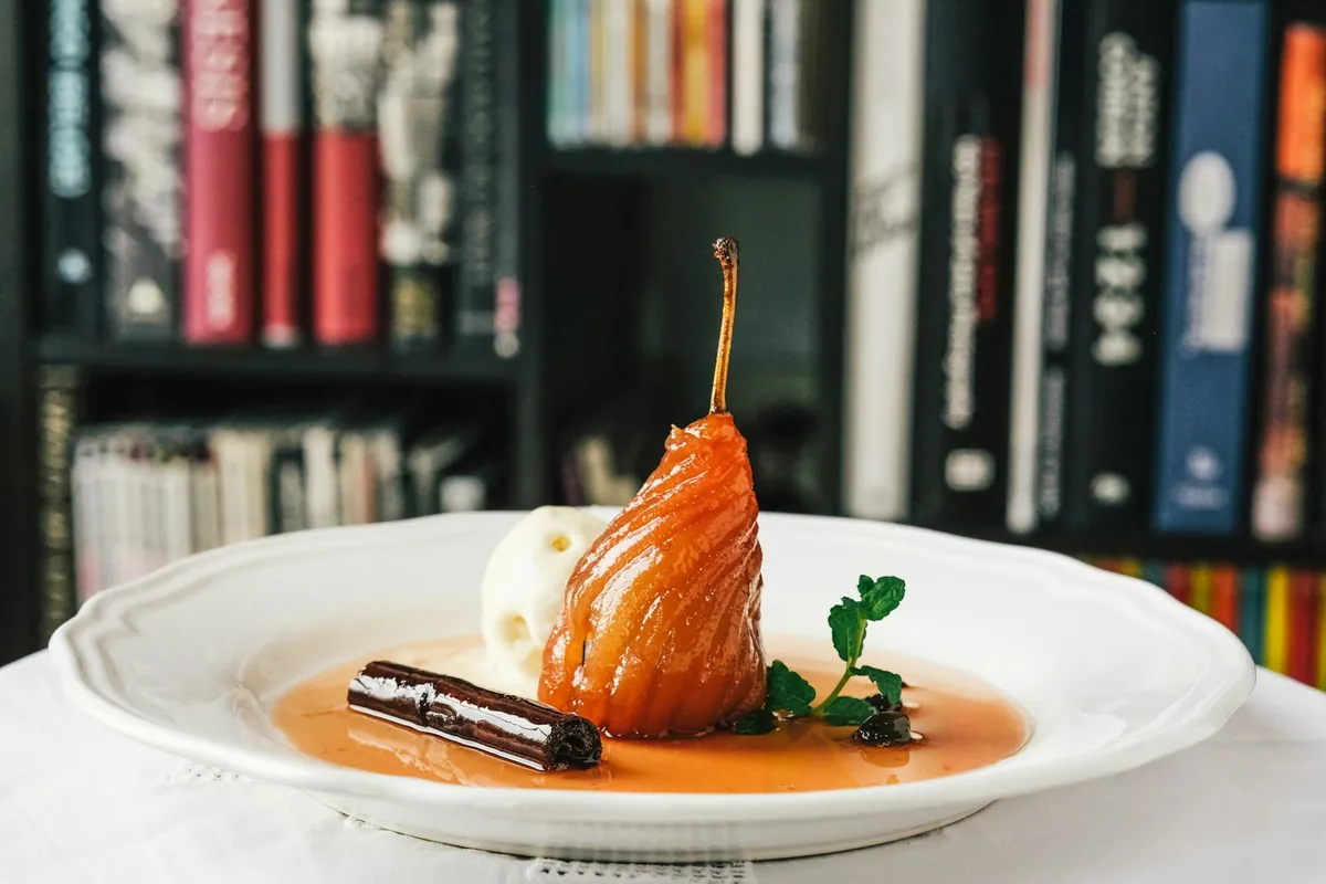 An elegant plated dessert in a fine-dining setting