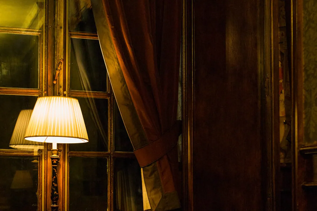 A warmly lit room at Hotel De Tuilerieën in Bruges