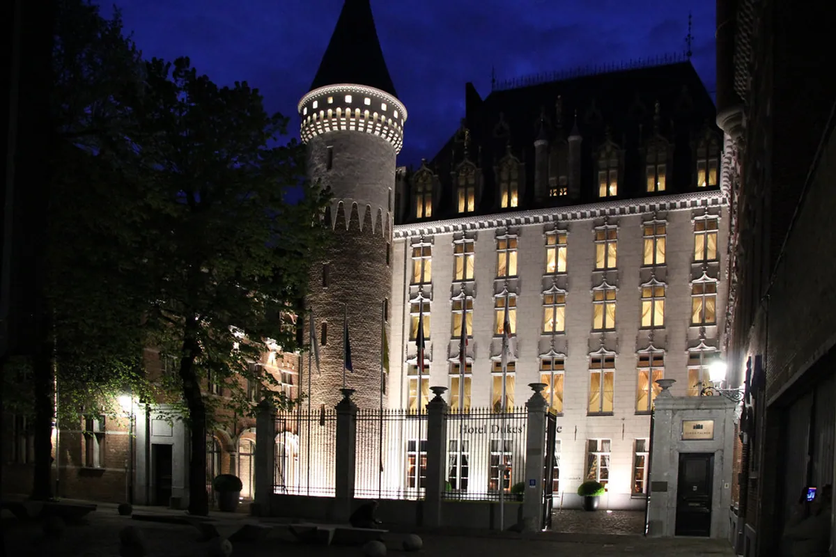 The illuminated entrance to Hotel Dukes' Palace in Bruges