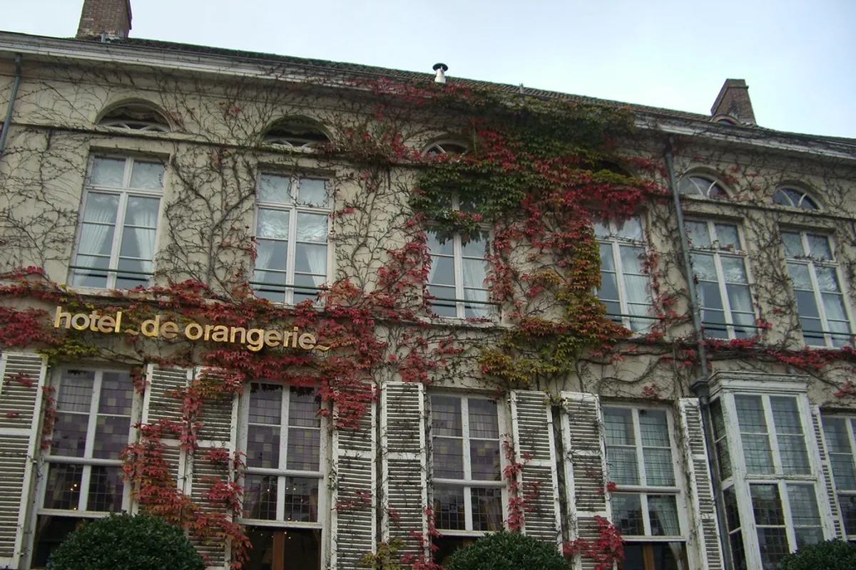 The ivy-covered façade of Hotel de Orangerie in Bruges