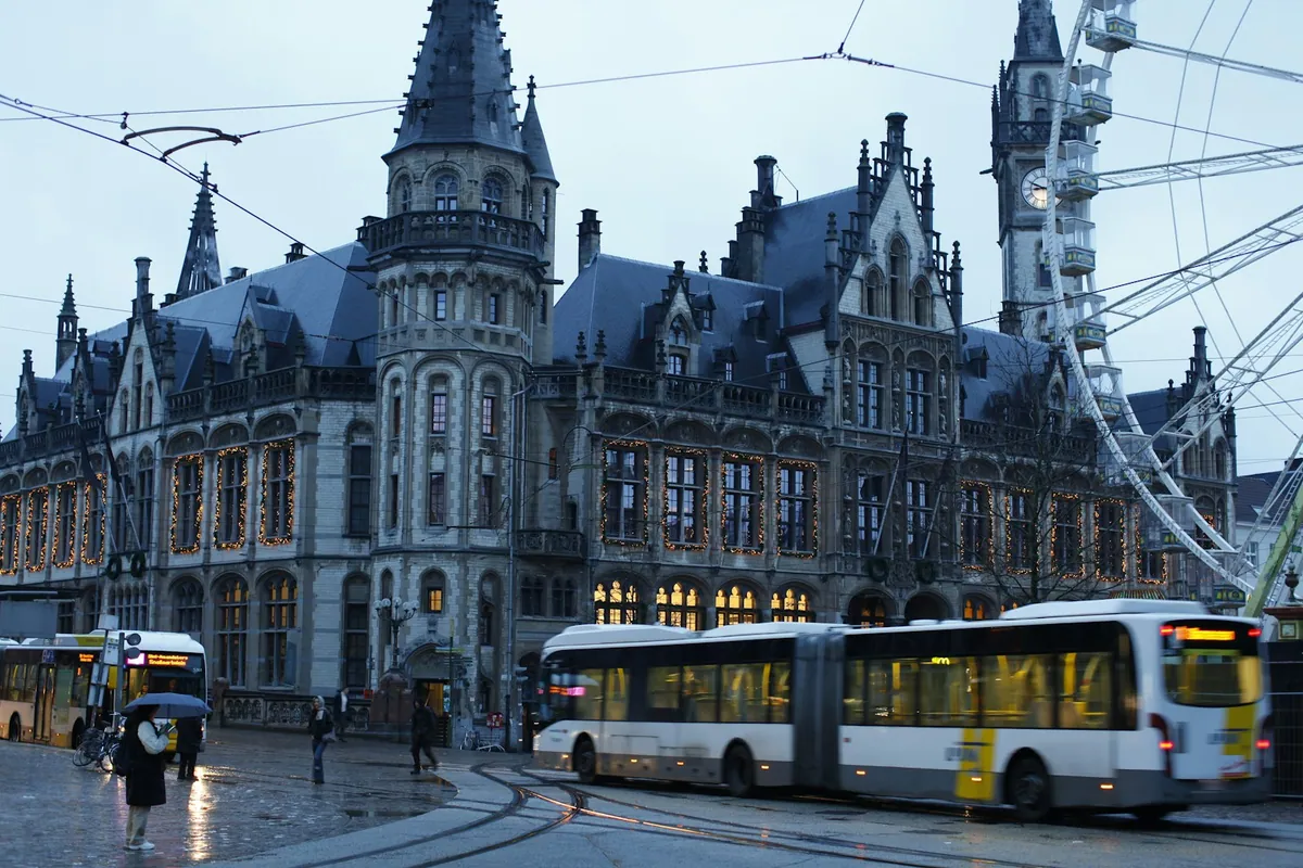 Regional buses waiting beside a Belgian station